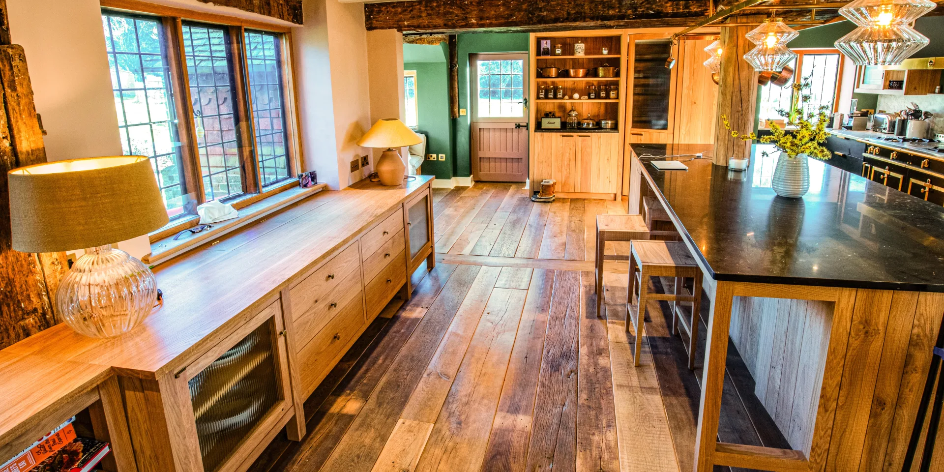 Rustic wide plank wood floor in a bright kitchen
